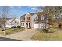 Attractive home with a two-car garage, manicured lawn, and a welcoming entrance at 105 Stoney Dr, Durham, NC 27703