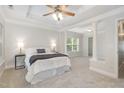 Spacious main bedroom with tray ceilings, columns and a serene, light-filled atmosphere at 109 Longchamp Ln, Cary, NC 27519