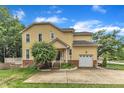 Charming exterior showcasing a manicured lawn, driveway, and a one-car garage at 11012 Southwalk Ln, Raleigh, NC 27614