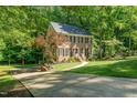 Well-maintained home with a brick facade and a long driveway at 1104 Berwyn Way, Raleigh, NC 27615