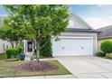 Well-maintained home with a lush front yard and attached two-car garage at 1520 Palmer Hill Dr, Durham, NC 27703
