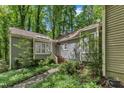Exterior showing a charming home with well-maintained landscaping and a welcoming entrance at 1702 Falls Church Rd, Raleigh, NC 27609