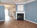 Bright living room with a fireplace and hardwood floors at 1924 Barngate Way, Raleigh, NC 27614