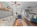 Cozy living room with modern decor, wood floors, and inviting seating at 214 Cedar Elm Rd, Durham, NC 27713