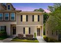 Inviting two-story townhome featuring neutral siding, dark shutters, and well-maintained landscaping at 246 Spark St, Raleigh, NC 27606