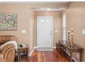 Welcoming entryway with hardwood floors, neutral walls, and classic decor at 342 Faith Dr, Gibsonville, NC 27249
