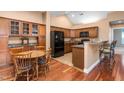 Eat-in kitchen features granite counters, stainless appliances, and wood cabinets at 342 Faith Dr, Gibsonville, NC 27249