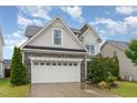Attractive home exterior with a two-car garage and tidy landscaping at 3904 Freemark Ln, Fuquay Varina, NC 27526