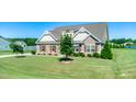 Expansive front yard with mature trees offers privacy and curb appeal to this lovely home in a nice neighborhood at 3909 Mendenhall Dr, Zebulon, NC 27597