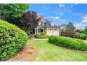 Charming home with landscaped front yard, two-car garage, and inviting entrance at 404 Brightling Way, Holly Springs, NC 27540