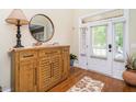 Light and airy foyer featuring hardwood floors, stylish furnishings, and a welcoming ambiance at 4266 Aviemore Run, Burlington, NC 27215