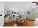 Bright and spacious living room with hardwood floors, fireplace, and ample seating at 4621 Youngsbury Ct, Raleigh, NC 27604