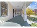 Spacious front porch with a swing, offering a relaxing outdoor space at 504 Hillcrest Ave, Burlington, NC 27215