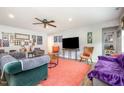 Spacious living room featuring hardwood floors, neutral paint, stylish decor and ceiling fan at 553 Isley Rd, Haw River, NC 27258
