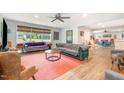 Inviting living room with lots of natural light, hardwood floors, and comfortable seating at 553 Isley Rd, Haw River, NC 27258