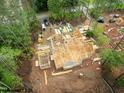 Bird's eye view of the new home construction, surrounded by lush trees at 8021 Bud Morris Rd, Wake Forest, NC 27587