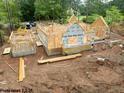 Aerial view of the new home under construction with wood frame on a large lot at 8021 Bud Morris Rd, Wake Forest, NC 27587