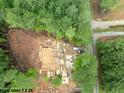 Aerial view of a home being built with lumber surrounding it on a large lot at 8021 Bud Morris Rd, Wake Forest, NC 27587