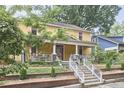 Charming two-story home with a covered front porch and well-maintained landscaping at 813 Burch Ave, Durham, NC 27701
