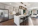 Modern kitchen with stainless steel appliances, quartz countertops, and an island with bar seating at 10518 Pleasant Branch Dr # 33, Raleigh, NC 27614