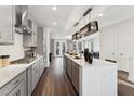 Bright, open kitchen featuring stainless steel appliances, light gray cabinets, and an island with pendant lighting at 10518 Pleasant Branch Dr # 33, Raleigh, NC 27614