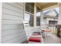 Inviting porch with white rocking chairs and red cushions, perfect for relaxing outdoors at 1528 Anthology Dr, Durham, NC 27703