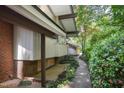 This home has well-maintained landscaping, a stone pathway, and a unique exterior, creating an inviting and tranquil atmosphere at 1604 Pinecrest Rd, Durham, NC 27705