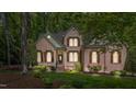 Beautiful brick home with well-maintained landscaping, wood shutters and covered front entrance at 205 Benwell Ct, Cary, NC 27519