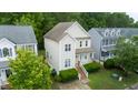 Two-story home boasts a well-maintained lawn and classic architecture at 2420 Sapphire Valley Dr, Raleigh, NC 27604