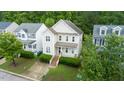 Two-story home with a well-manicured lawn and classic architectural design at 2420 Sapphire Valley Dr, Raleigh, NC 27604