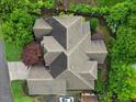 Aerial shot of a home with a complex roofline, surrounded by mature trees and manicured landscaping at 2507 Mayview Rd, Raleigh, NC 27607