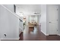 Inviting foyer featuring hardwood floors and a view of the open-concept living area at 2622 Perthshire Ln, Fuquay Varina, NC 27526