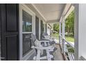 Relaxing front porch with comfortable seating, perfect for enjoying the outdoors at 2721 Dahlgreen Rd, Raleigh, NC 27615