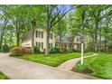 A well-maintained home with a brick walkway and verdant landscaping at 3123 Amherst Ave, Burlington, NC 27215