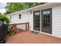 Private outdoor deck with access via double doors, perfect for relaxing or entertaining at 3627 Nc 57, Hillsborough, NC 27278