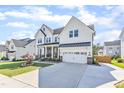 Charming two-story home with a well-manicured lawn, brick accents, and a spacious driveway at 508 White Oak Branch Ln, Apex, NC 27523
