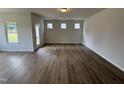 Bright living room showcasing beautiful wood floors, natural light, and a functional, spacious open design at 51 Commons Cir, Clayton, NC 27520