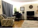 Inviting living space featuring neutral walls, comfortable seating, and a desk area at 7 Shepherd Ln # Bldg D, Chapel Hill, NC 27514