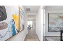Hallway view with modern artwork and seamless transition to the dining area at 7384 Michelle Rd, Rocky Mount, NC 27803