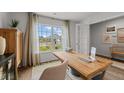 Cozy office space featuring a wooden desk, natural light, and a chair at 7400 Michelle Rd, Rocky Mount, NC 27803