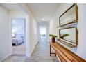Bright hallway features wood-look floors, accent furniture and decor, and views to living spaces at 7407 Michelle Rd, Rocky Mount, NC 27803