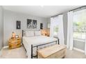 Serene bedroom showcasing neutral tones, natural light, and tasteful decor at 8615 Kenridge Ln, Fuquay Varina, NC 27526