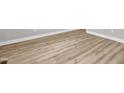 Close-up of durable, light-colored, wide-planked wood-look flooring at 1003 Wicksteed Ct, Apex, NC 27502