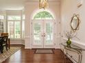 Bright foyer with hardwood floors, double doors, and stylish decor creating a welcoming entrance at 101 Temple Gate Dr, Cary, NC 27518