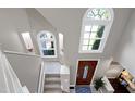 Bright foyer boasts large arched windows above the front door, providing lots of natural light from the second story at 103 Uxbridge Ct, Cary, NC 27513