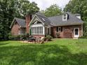 Charming brick home with spacious yard and outdoor patio area at 104 Deer Park Ln, Cary, NC 27518