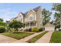 Lovely traditional home with a detached garage and driveway with mature landscaping at 128 Low Country Ct, Morrisville, NC 27560