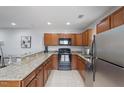 Well-lit kitchen featuring granite countertops and stainless steel appliances at 130 E Longview St # Apt S, Chapel Hill, NC 27516