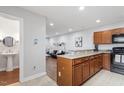 Open concept kitchen featuring granite countertops, and seamless access to the living area at 130 E Longview St # Apt S, Chapel Hill, NC 27516