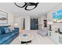 Inviting bonus room featuring a large sectional, bean bag chair, and a view into an upstairs hall at 147 Sugar Pine Drive, Franklinton, NC 27525
